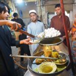 A vendor selling boiled eggs and traditional Yakhni at Hashtnagri area.