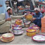 A vendor selling handmade bread Hot Pots at Mezan Chowk