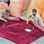 Vendors busy sewing and manually making woven quilt at his work place for upcoming winter as the demand for woolies and quilts