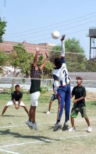 A view of volleyball match played between SD High School and Yazman teams during Inter-District Government Schools Sports Tournament at SD High School Ground.