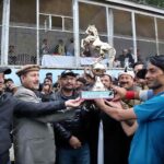 Minister Local Govt GB Abdul Hameed giving away Winner trophy to polo team captain during the "Sarfaranga Cold Desert Rally 5th Edition 2023 in Final round at world highest desert sarfaranga