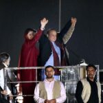 PML-N Supremo and former Prime Minister Nawaz Sharif waving to the crowd before his first address to a public rally at Minar-e-Pakistan after he returned to country after four years of self-exile in London