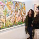 Visitors taking keen interest in the masterful works of Farrukh Shahab titled “Ethereal Bond" at Tanzara Gallery
