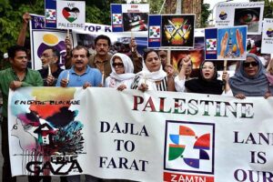 Activists of civil society holding play cards during a protest demonstration to show solidarity with the people of Palestine and take part in an anti-Israel demonstration outside the Press club
