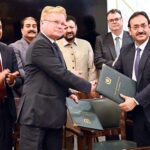 Provincial Secretary Power Gilgit-Baltistan and Chairman of Nor Hydro are signing the memorandum of understanding for the solar energy project started with the cooperation of Norway, Chief Minister Gilgit-Baltistan Haji Gulbar Khan and ambassador of Norway is also present