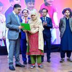 The Caretaker Prime Minister Anwaar-ul-Haq Kakar distributes cheques among the families of martyred polio workers and polio workers who got injured in the line of duty