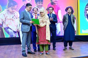 The Caretaker Prime Minister Anwaar-ul-Haq Kakar distributes cheques among the families of martyred polio workers and polio workers who got injured in the line of duty