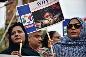 Activists of civil society holding play cards during a protest demonstration to show solidarity with the people of Palestine and take part in an anti-Israel demonstration outside the Press club