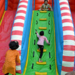 Children enjoying slides, playing at playland in Baghe Jinnah Park