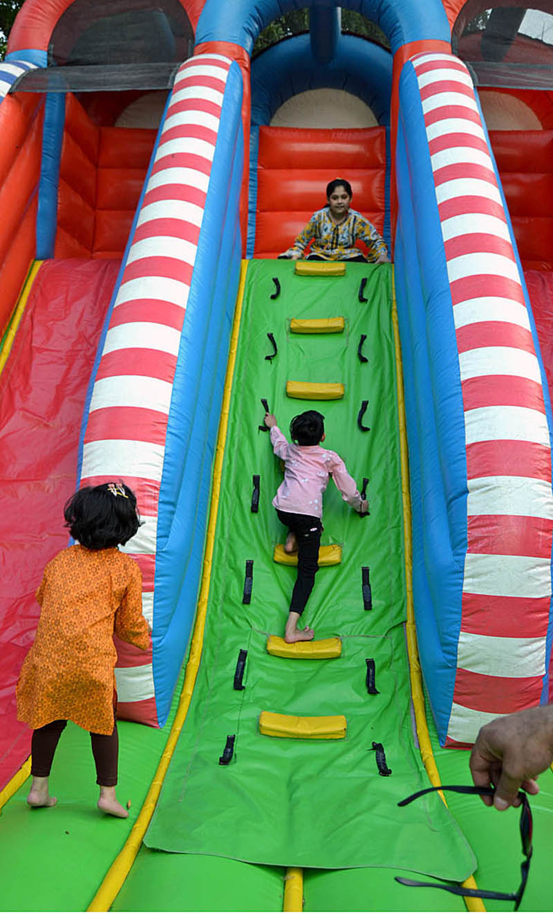 Children enjoying slides, playing at playland in Baghe Jinnah Park