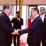 Caretaker Prime Minister Anwaar-ul-Haq Kakar and Deputy Party Secretary of Xinjiag Production and Construction Corps Mr. Li Yifei shake hands prior to their meeting