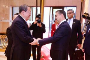 Caretaker Prime Minister Anwaar-ul-Haq Kakar and Deputy Party Secretary of Xinjiag Production and Construction Corps Mr. Li Yifei shake hands prior to their meeting