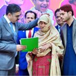 The Caretaker Prime Minister Anwaar-ul-Haq Kakar distributes cheques among the families of martyred polio workers and polio workers who got injured in the line of duty