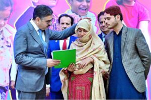 The Caretaker Prime Minister Anwaar-ul-Haq Kakar distributes cheques among the families of martyred polio workers and polio workers who got injured in the line of duty
