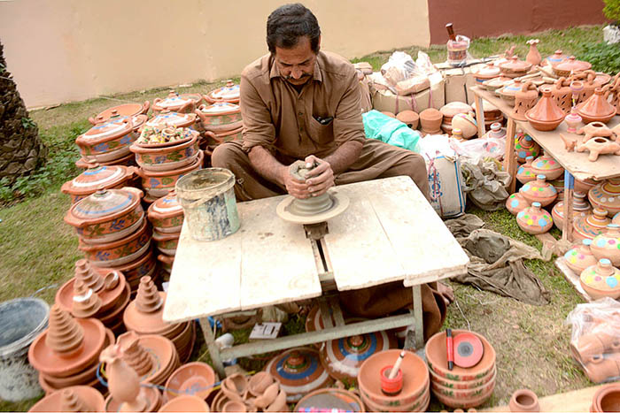 Worker are buying and selling at various stalls at the cultural fair in a festival at Jilani Park.