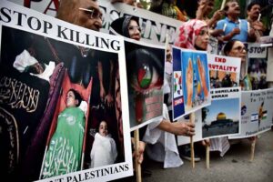 Activists of civil society holding play cards during a protest demonstration to show solidarity with the people of Palestine and take part in an anti-Israel demonstration outside the Press club