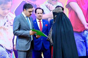 The Caretaker Prime Minister Anwaar-ul-Haq Kakar distributes cheques among the families of martyred polio workers and polio workers who got injured in the line of duty