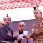 Force Commander Gilgit-Baltistan Kashif Khalil giving away shield and certificate to participant during the opening of Sarfaranga Cold Desert Rally 5th Edition 2023
