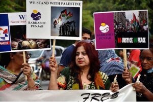 Activists of civil society holding play cards during a protest demonstration to show solidarity with the people of Palestine and take part in an anti-Israel demonstration outside the Press club