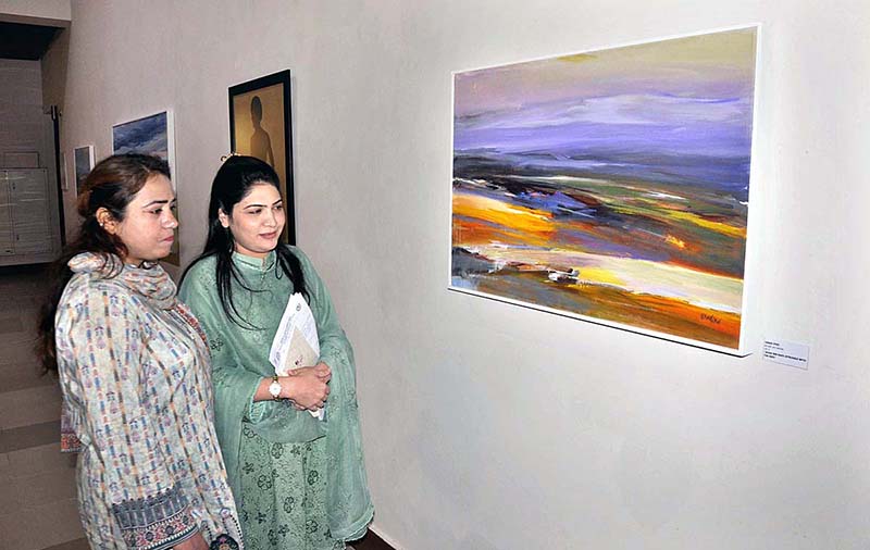 Visitors keenly viewing art work displayed during an exhibition PNCA & Nomad gallery present Safar-Journey of the Mavericks three person curetted by Nageen Hyat at PNCA