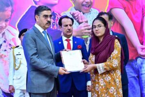 The Caretaker Prime Minister Anwaar-ul-Haq Kakar distributes cheques among the families of martyred polio workers and polio workers who got injured in the line of duty