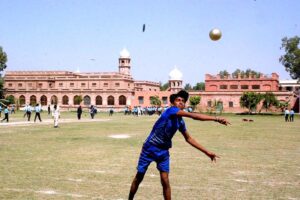 Student athletes throwing the shot put away in the Government Schools inter-tehsil school sports program