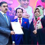 The Caretaker Prime Minister Anwaar-ul-Haq Kakar distributes cheques among the families of martyred polio workers and polio workers who got injured in the line of duty