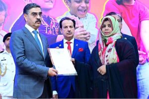 The Caretaker Prime Minister Anwaar-ul-Haq Kakar distributes cheques among the families of martyred polio workers and polio workers who got injured in the line of duty