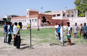 Student athletes throwing the shot put away in the Government Schools inter-tehsil school sports program