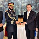 Secretary Senate, Mohammad Qasim Samad Khan presenting a shield to Syed Javed Azhar Hasni, Sargeant-at-Arms Senate Secretariat on his retirement from Senate Secretariat at Parliament House