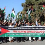 Rally which led by Anjuman-e-Tajiran Association President Rahim Agha passing at Qhandari Bazar against Israeli aggression on Palestinians