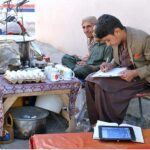 Youngster preparing for annual exam while selling soup and eggs to support family at Liaqaut Bazaar