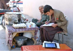 Youngster preparing for annual exam while selling soup and eggs to support family at Liaqaut Bazaar
