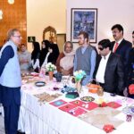 President Dr Arif Alvi viewing the handicrafts made by visually impaired persons, at Aiwan-e-Sadr