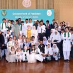 President Dr Arif Alvi and Begum Samina Alvi in a group photo with visually impaired persons at an event in connection with White Cane Safety Day, held at Aiwan-e-Sadr