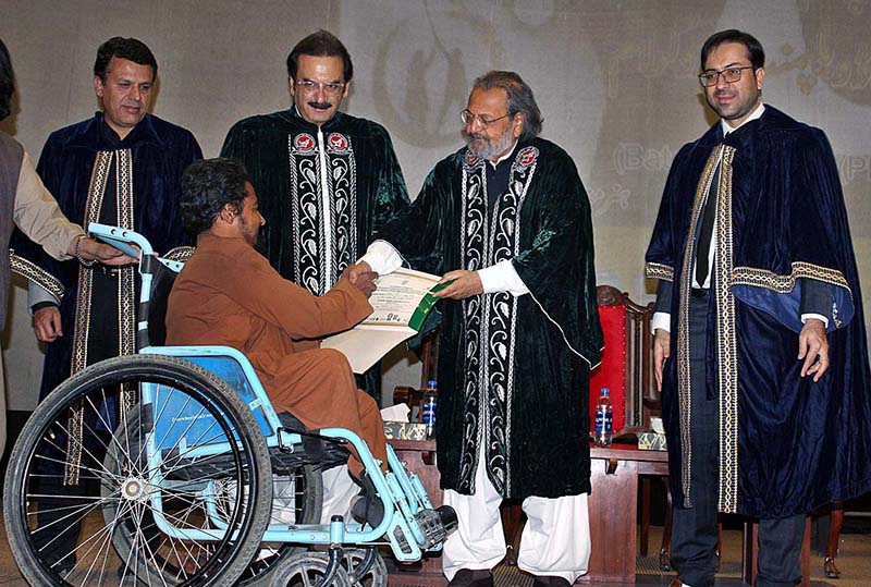 Caretaker Federal Minister for Education and Professional Training Madad Ali Sindhi distributing certificates in a graduation ceremony under PM’s Youth Skills Development Program at University of Balochistan