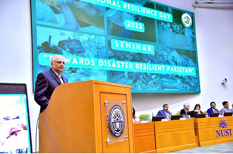 Caretaker Minister for Planning, Development and Special Initiative Mr. Muhammad Sami Saeed addressing during Seminar on National Resilience Day organized by NDMA at NUST University