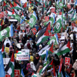 Women activists of Jamaat-i-Islami take part in a rally to express solidarity with Palestinians