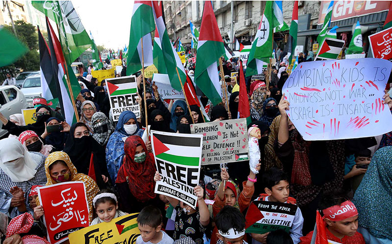 Women activists of Jamaat-i-Islami take part in a rally to express solidarity with Palestinians