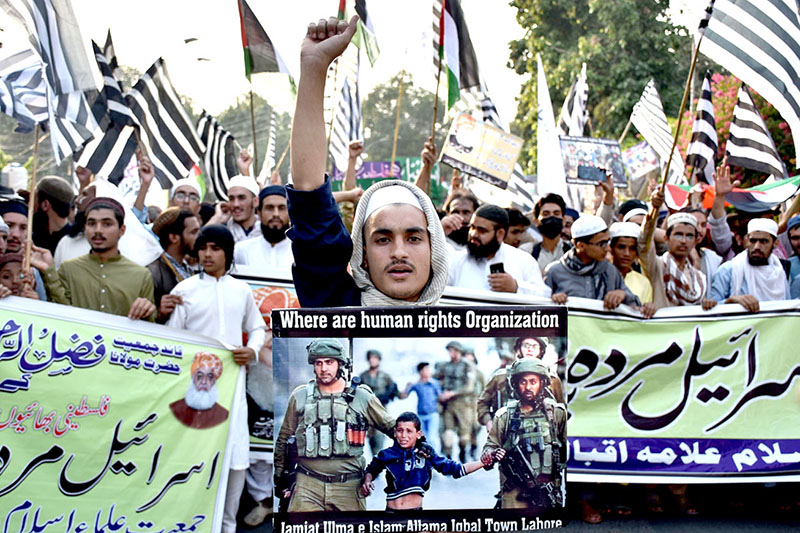 Pakistan's political party Jamiat Ulma-e-Islam and activists participating in a rally outside press club while thousands of people protested across the country after Friday prayers against Israel’s siege and fierce bombing on the Gaza Strip in retaliation to Hamas attacks