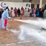 Rescue 1122 officials giving training on Health and Safety Measures Workshop to women organized by All Pakistan Women Association (APWA)