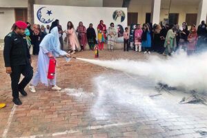 Rescue 1122 officials giving training on Health and Safety Measures Workshop to women organized by All Pakistan Women Association (APWA)