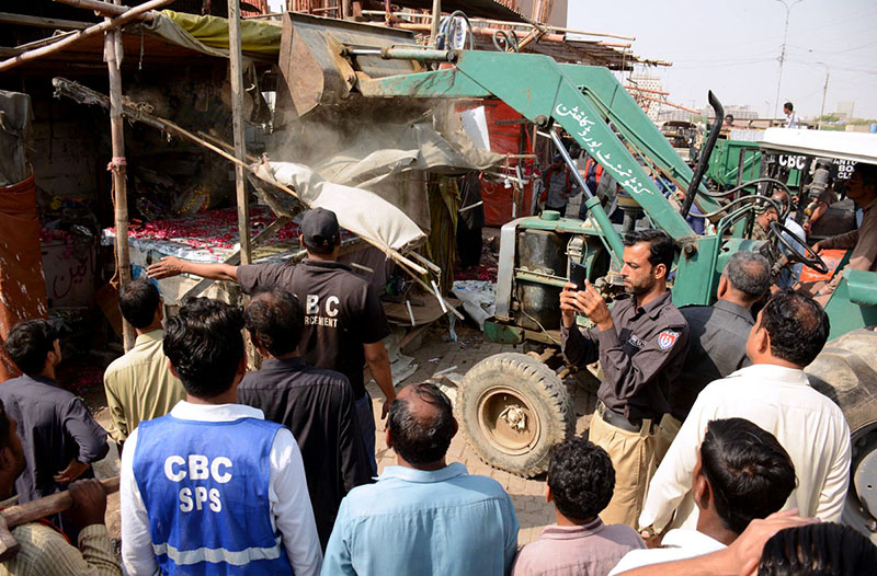 Cantonment Board workers removing illegal structures in anti-encroachment drive at Kalapul area