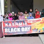 Karakoram International University students participating in a rally to mark 27th October as Kashmir Black Day