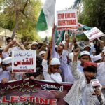Students attending the protest against Israeli aggression outside press club by Pakistan Sunni Tehreek