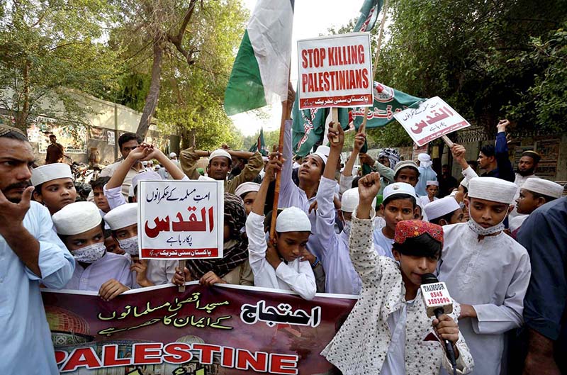 Students attending the protest against Israeli aggression outside press club by Pakistan Sunni Tehreek