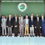 Caretaker Prime Minister Anwaar-ul-Haq Kakar in a group photo with NDMA's team after the inauguration of National Emergencies Operation Center in Islamabad