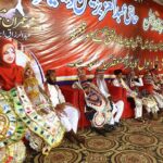 A large number of grooms sitting on stage during collective marriage organized by Jailani Welfare Organization at Bagh-e-Mustafa Ground.