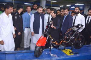 Caretaker Federal Interior Minister Sarfraz Bugti is talking to media persons after inauguration of electric motorbike unit at King Motorcycles near Chak No.209 Jaranwala Road