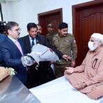 Caretaker Prime Minister Anwaar-ul-Haq Kakar visits patients who received free eye surgery from the government, in Mayo Hospital